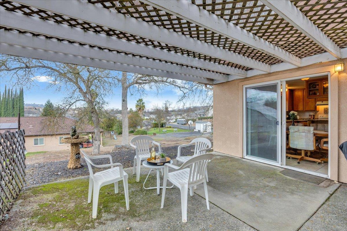 342 Poker Flat Road Copperopolis, CA 95228 - Photo 36 of 95 Dining room slider leads out to a covered concrete patio area for BBQing and relaxing.
