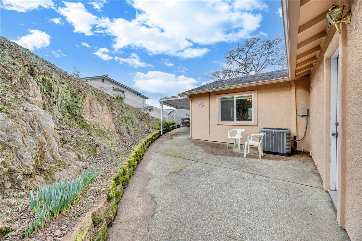 342 Poker Flat Road Copperopolis, CA 95228 - Photo 56 of 95 Sun patio area at the rear of garage. Newer A/C/HVAC units.