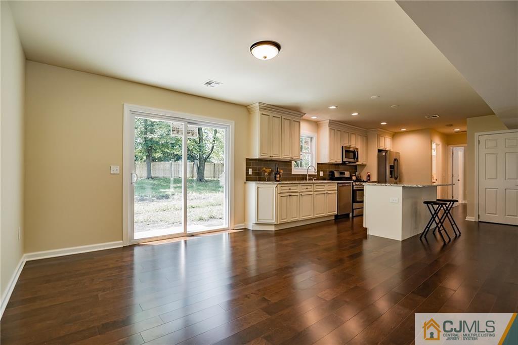 8 Dayton Road Edison, NJ 08817 - Photo 3 of 25 a kitchen with a table and chairs in it