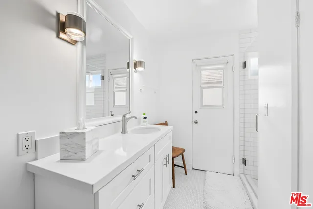 a bathroom with a sink a light fixture and a light fixture
