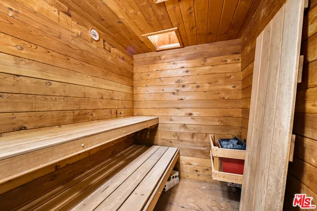 a room with a bed and furniture