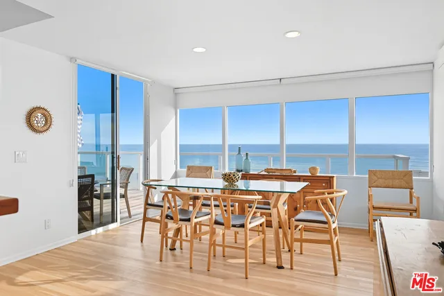 a view of a dining room with furniture and window