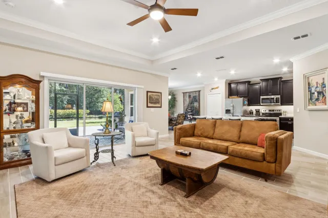 a bathroom with a granite countertop sink a toilet and a large mirror