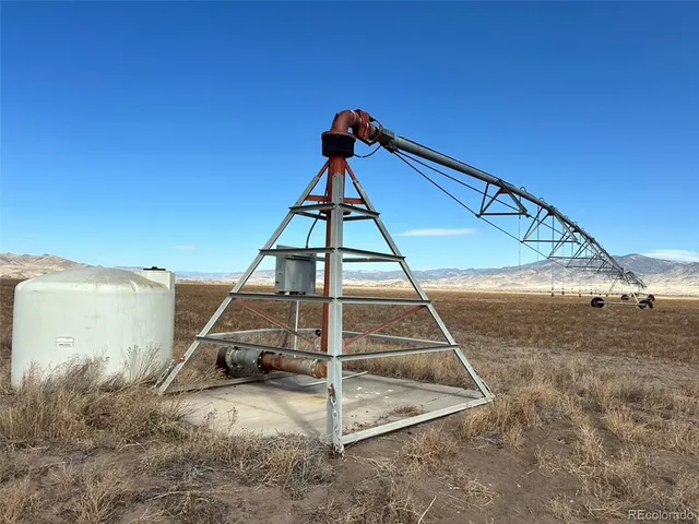 a bathroom with a toilet mirror and a mirror