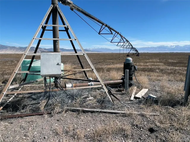a view of a swimming pool with a yard