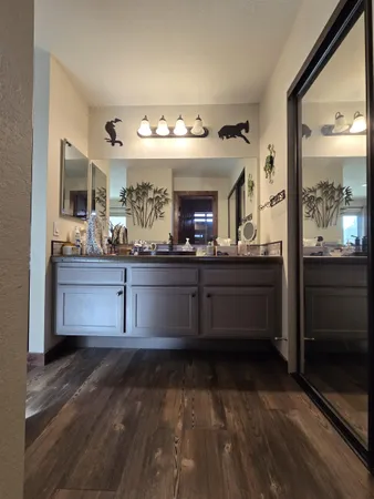 a kitchen with granite countertop a sink and cabinets