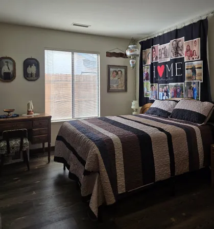 a bedroom with a bed and window