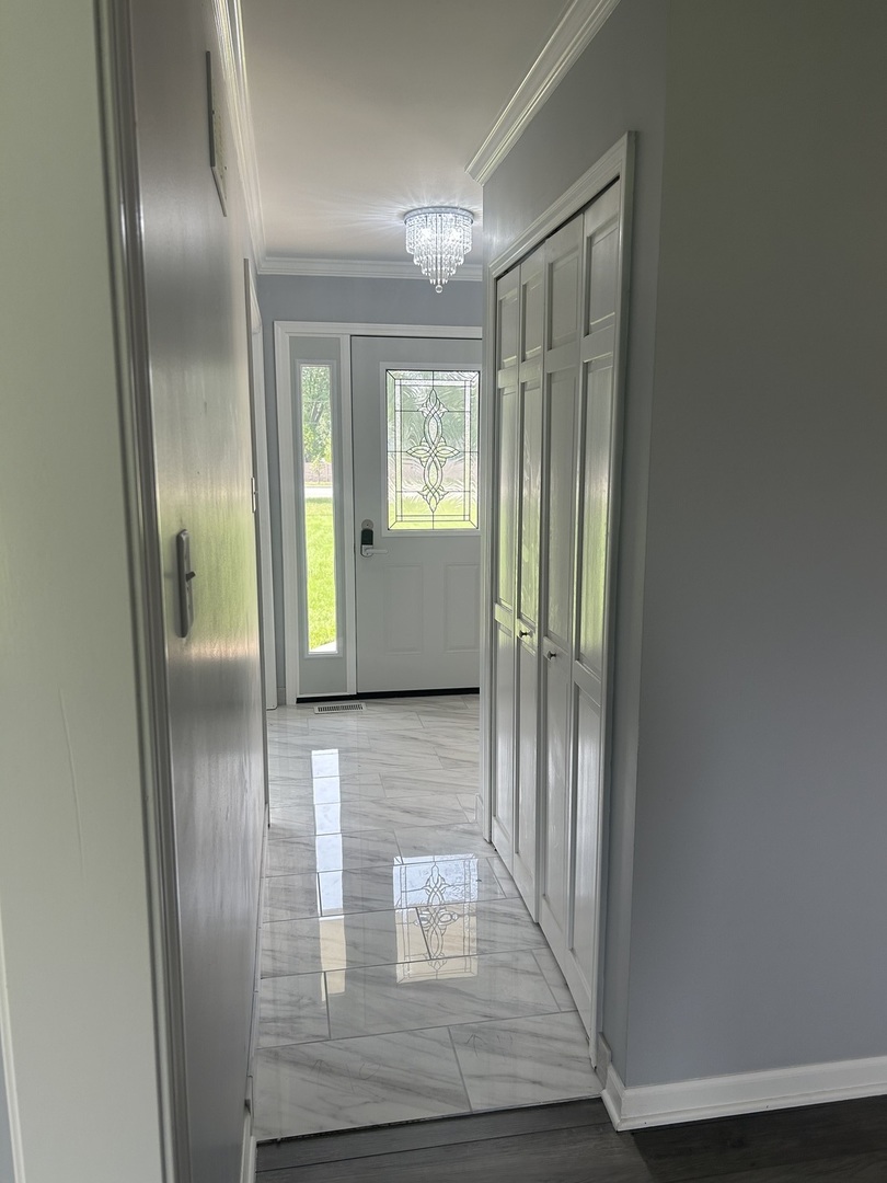 32-w320 Montgomery Road Aurora, IL 60504 - Photo 11 of 37 a view of gallery with wooden floor