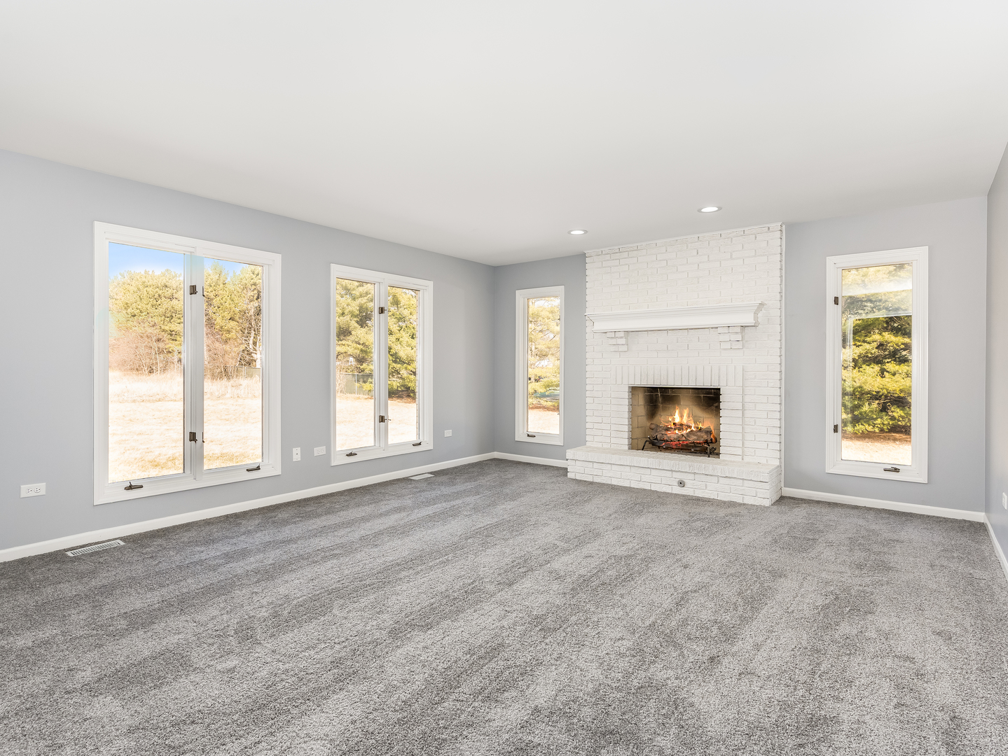 32-w320 Montgomery Road Aurora, IL 60504 - Photo 15 of 37 an empty room with windows and fireplace