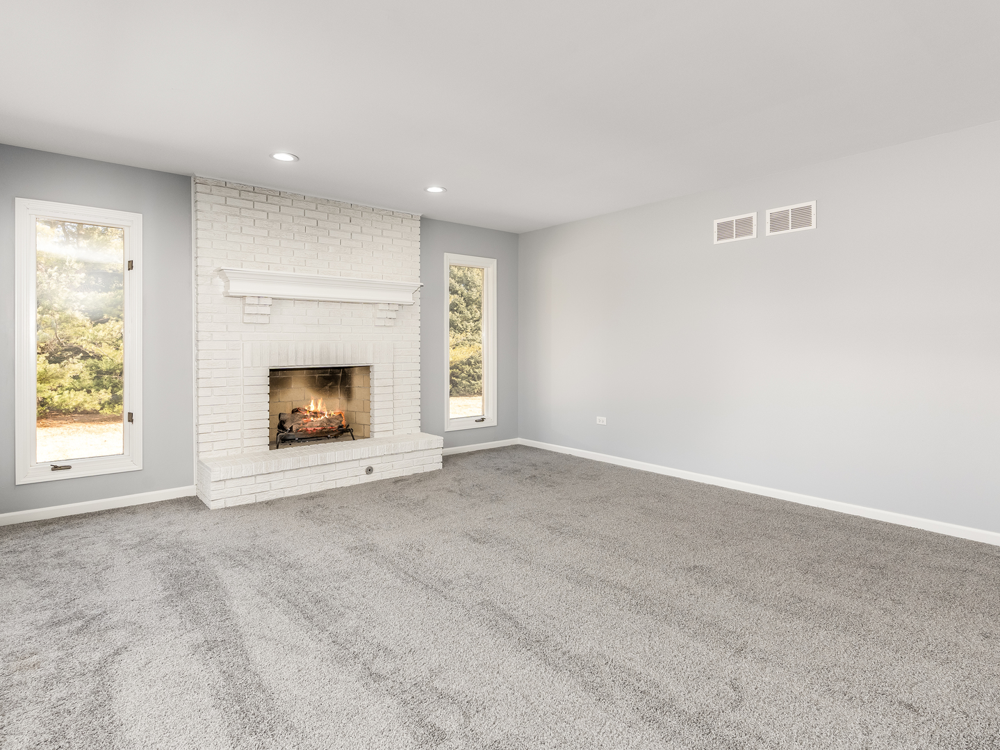 32-w320 Montgomery Road Aurora, IL 60504 - Photo 16 of 37 an empty room with a fireplace and window