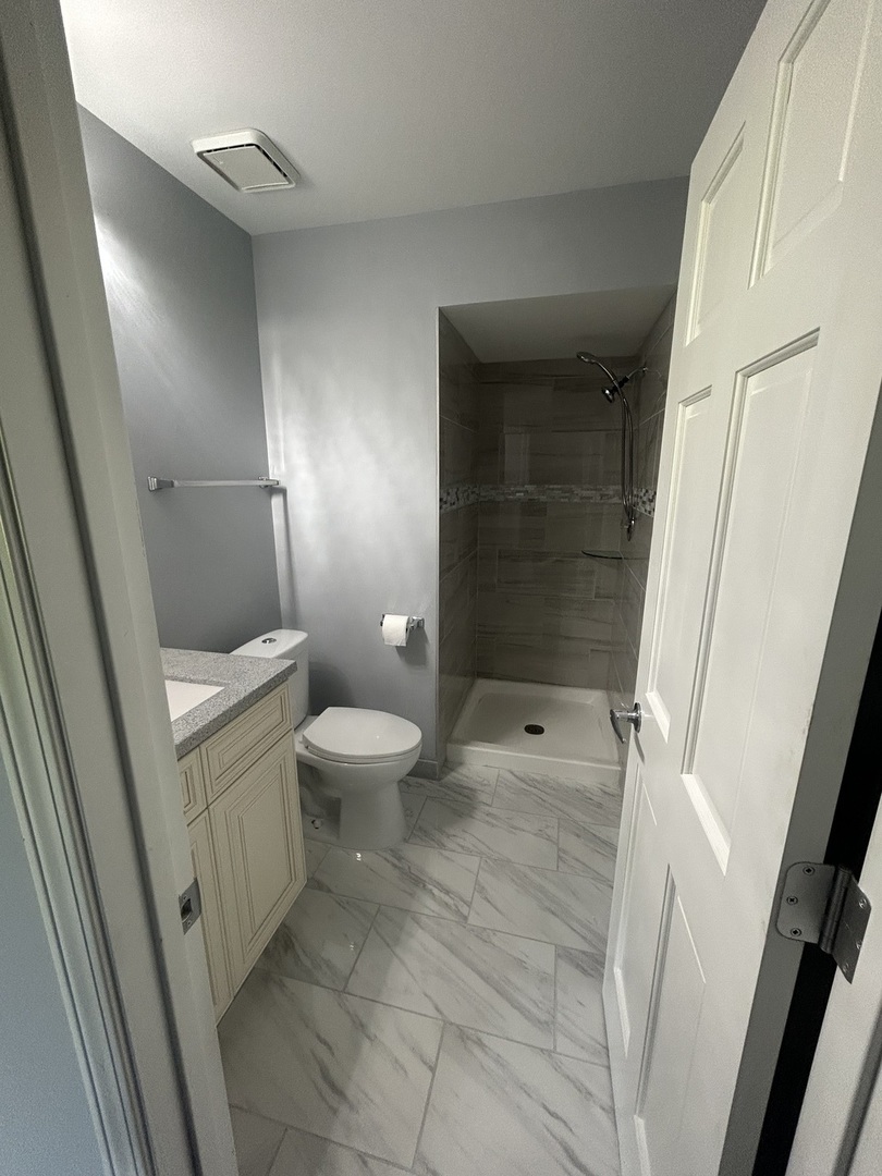 32-w320 Montgomery Road Aurora, IL 60504 - Photo 24 of 37 a bathroom with a sink a toilet and shower