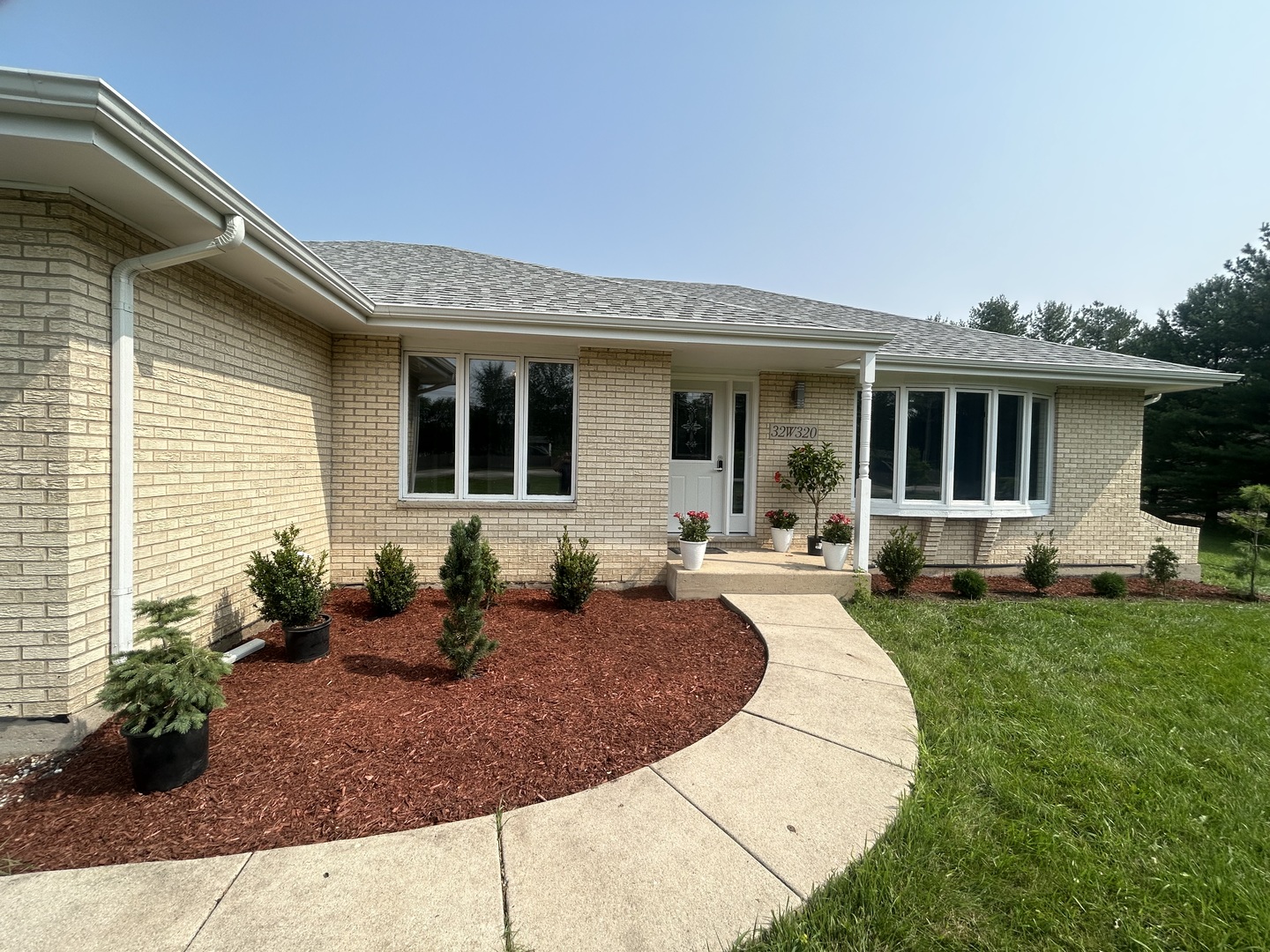 32-w320 Montgomery Road Aurora, IL 60504 - Photo 3 of 37 a view of a house with backyard sitting area and swimming pool