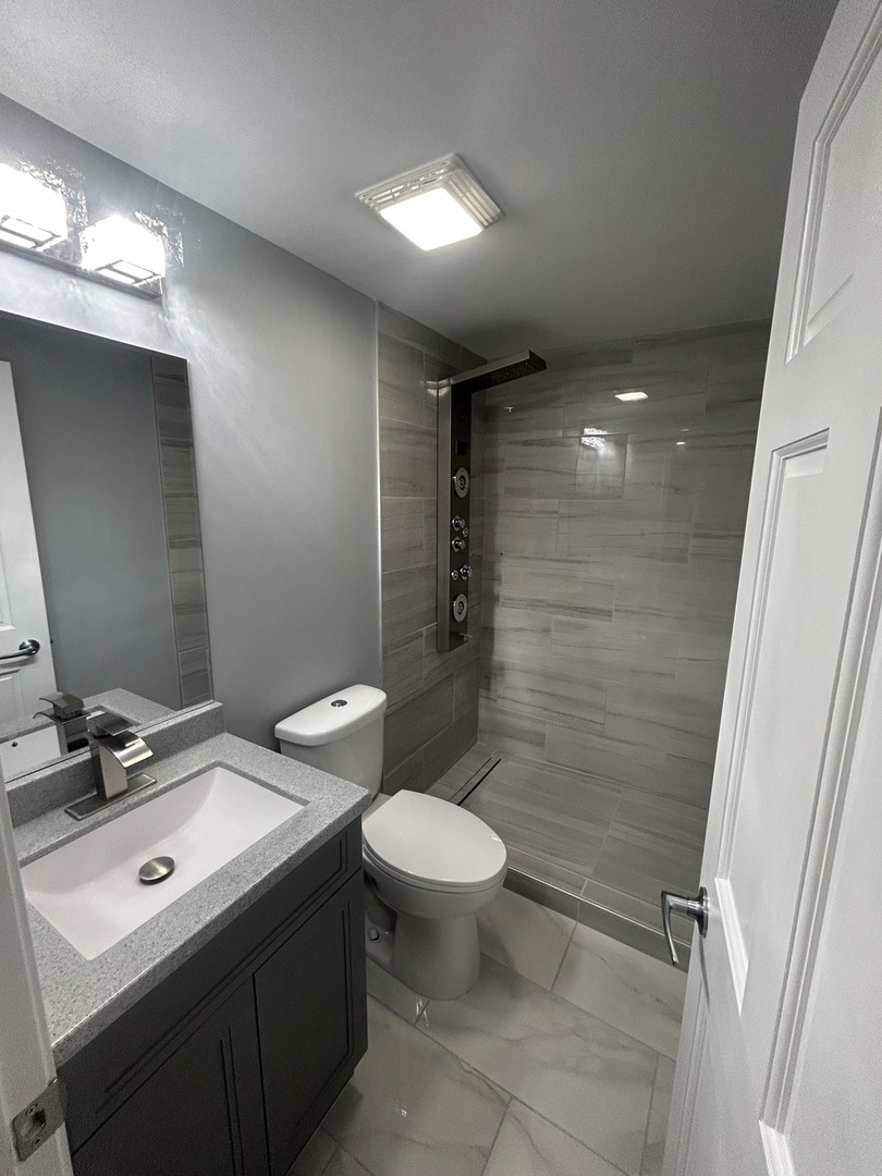 32-w320 Montgomery Road Aurora, IL 60504 - Photo 31 of 37 a bathroom with a toilet sink and mirror