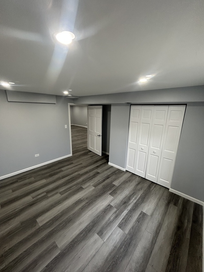 32-w320 Montgomery Road Aurora, IL 60504 - Photo 34 of 37 a view of an empty room with wooden floor