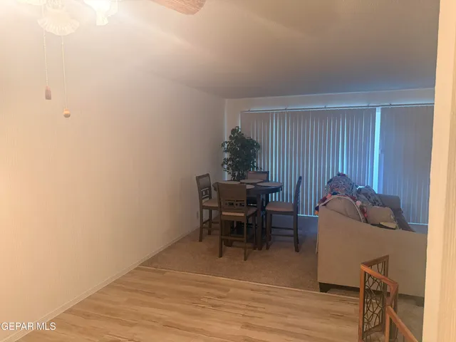 a workspace room with furniture and wooden floor