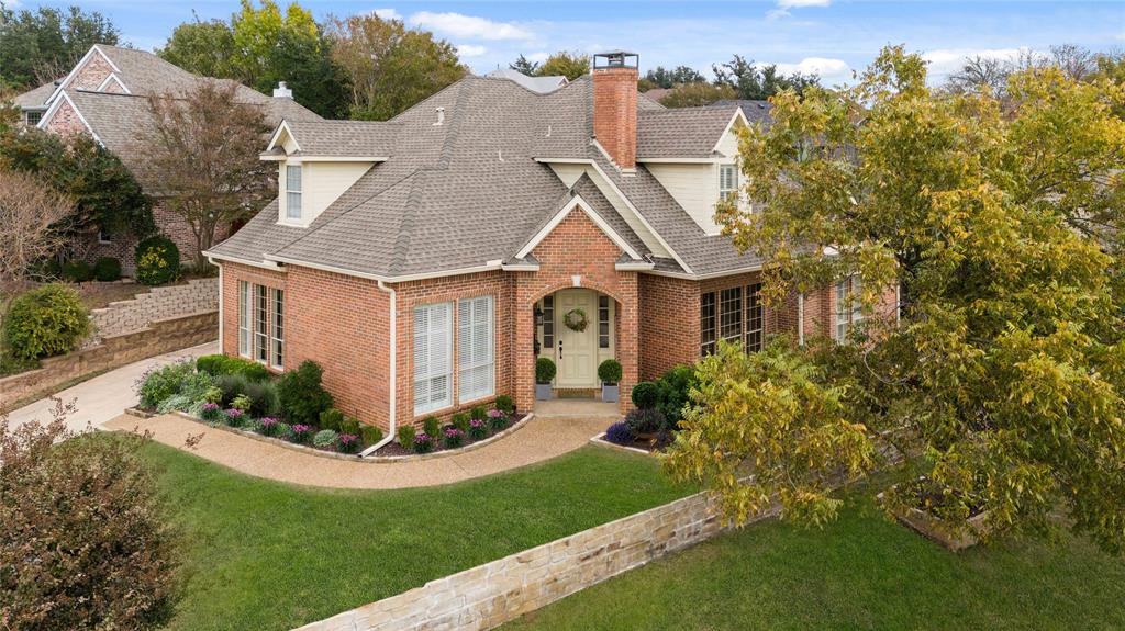 102 Weatherly Circle Rockwall, TX 75032 - Photo 1 of 39 a front view of a house with a yard