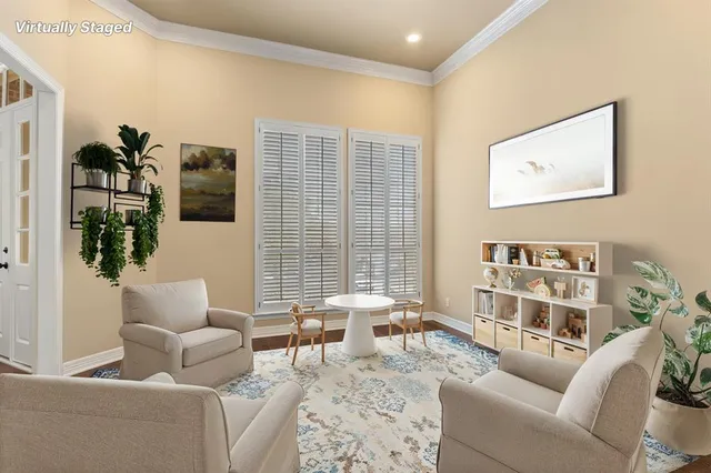 a bedroom with a bed a dresser and wooden floor