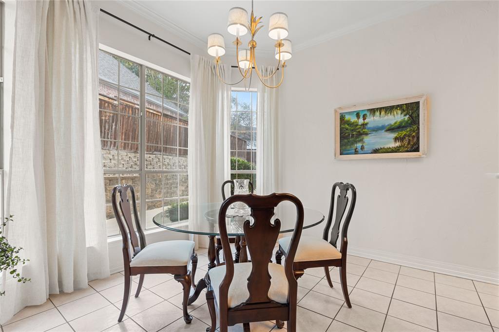 102 Weatherly Circle Rockwall, TX 75032 - Photo 12 of 39 a view of a dining room with furniture and a chandelier