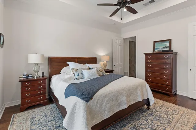 a bedroom with a bed and a dresser