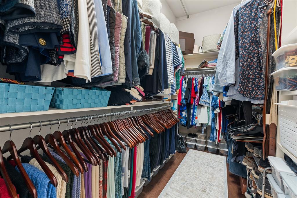 102 Weatherly Circle Rockwall, TX 75032 - Photo 23 of 39 a view of walk in closet with clothes and shoes
