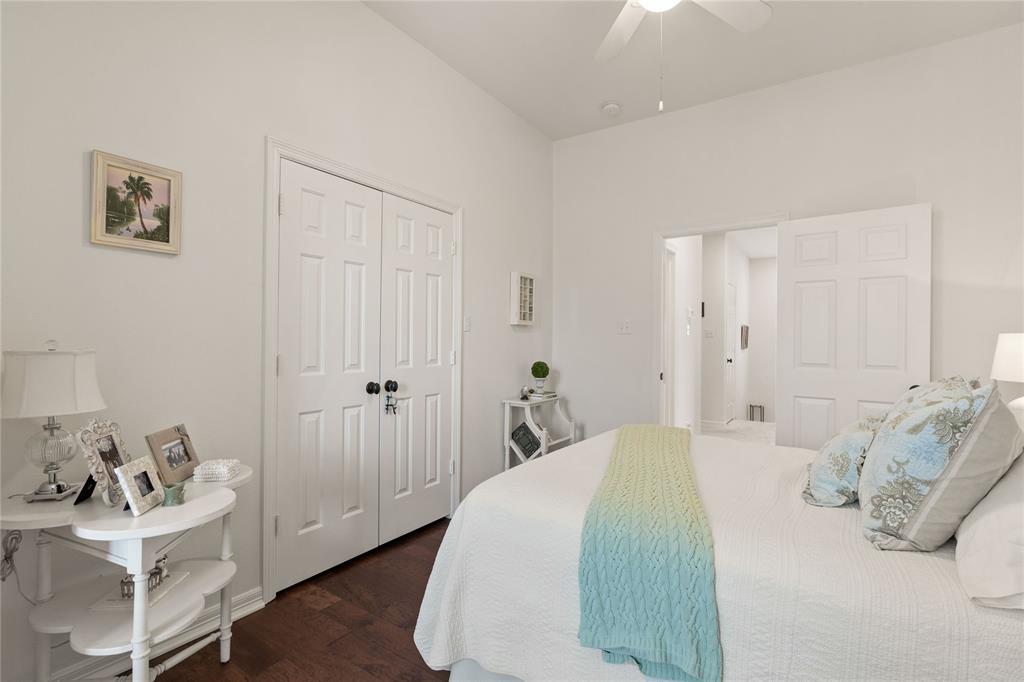 102 Weatherly Circle Rockwall, TX 75032 - Photo 28 of 39 a bedroom with a bed and a chair