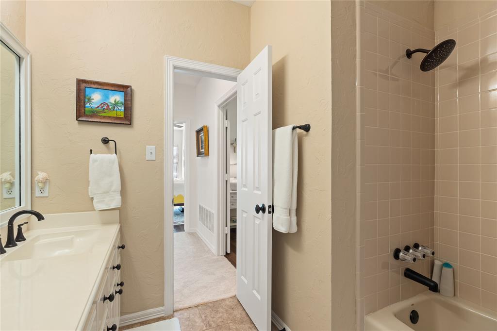102 Weatherly Circle Rockwall, TX 75032 - Photo 30 of 39 a bathroom with a tub sink and shower