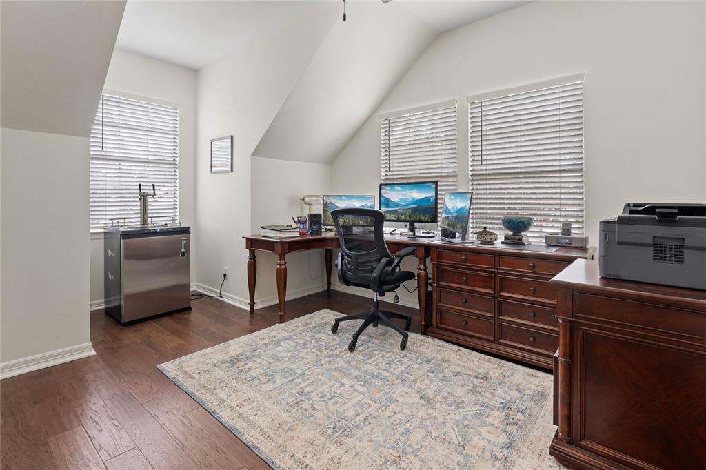 102 Weatherly Circle Rockwall, TX 75032 - Photo 31 of 39 a view of a workspace with furniture and a window
