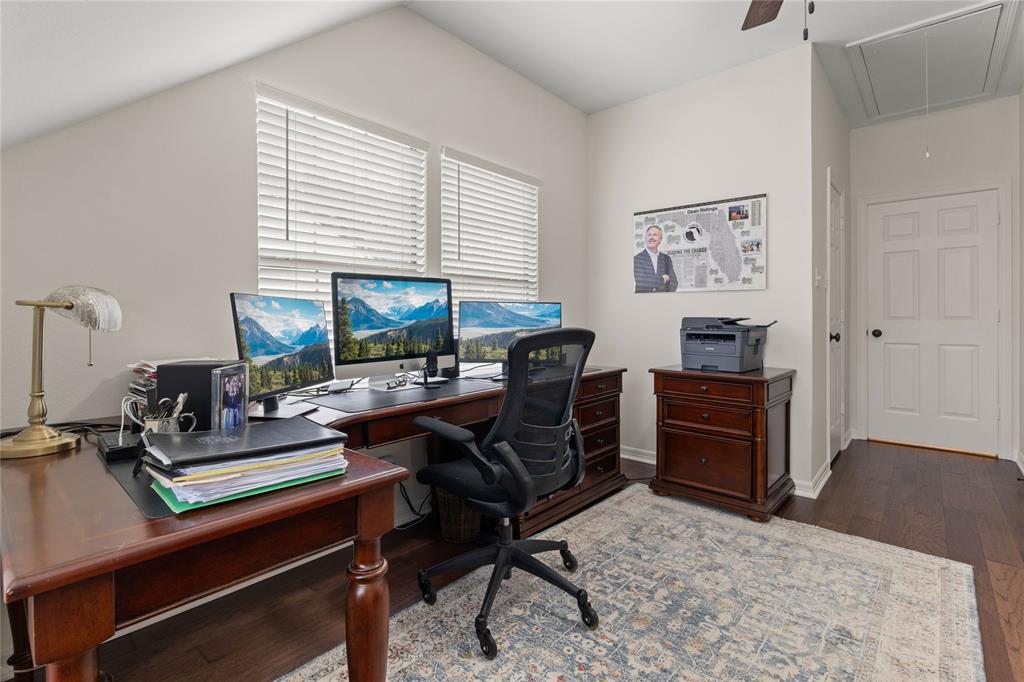 102 Weatherly Circle Rockwall, TX 75032 - Photo 32 of 39 a view of a workspace with furniture and a window