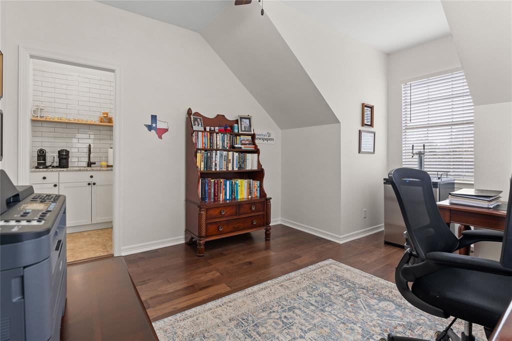 102 Weatherly Circle Rockwall, TX 75032 - Photo 33 of 39 a view of a workspace with furniture and a window