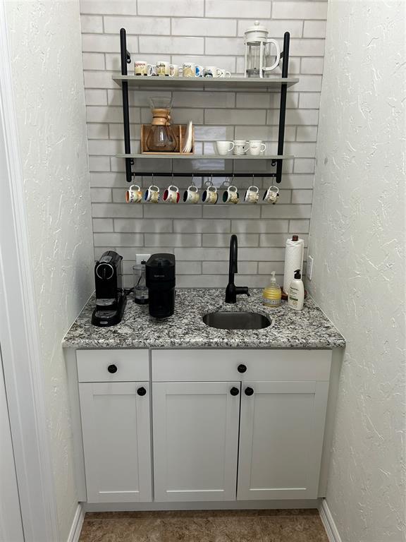 102 Weatherly Circle Rockwall, TX 75032 - Photo 34 of 39 a kitchen with stainless steel appliances granite countertop a sink and cabinets