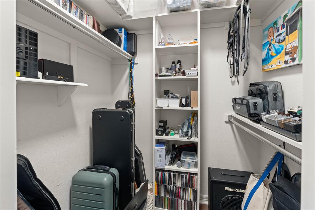 102 Weatherly Circle Rockwall, TX 75032 - Photo 35 of 39 a view of storage and utility room with fridge and rack