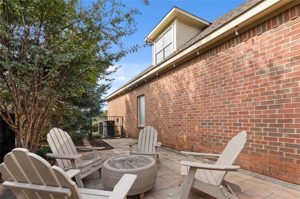 102 Weatherly Circle Rockwall, TX 75032 - Photo 37 of 39 a view of patio with table and chairs and couches