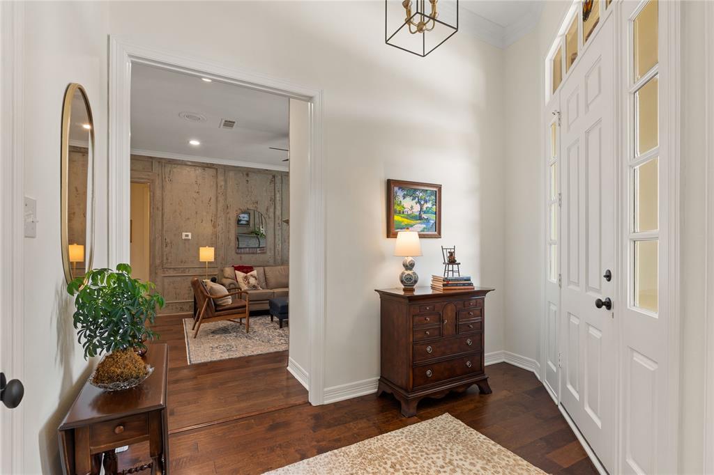 102 Weatherly Circle Rockwall, TX 75032 - Photo 8 of 39 a view of an entryway with wooden floor