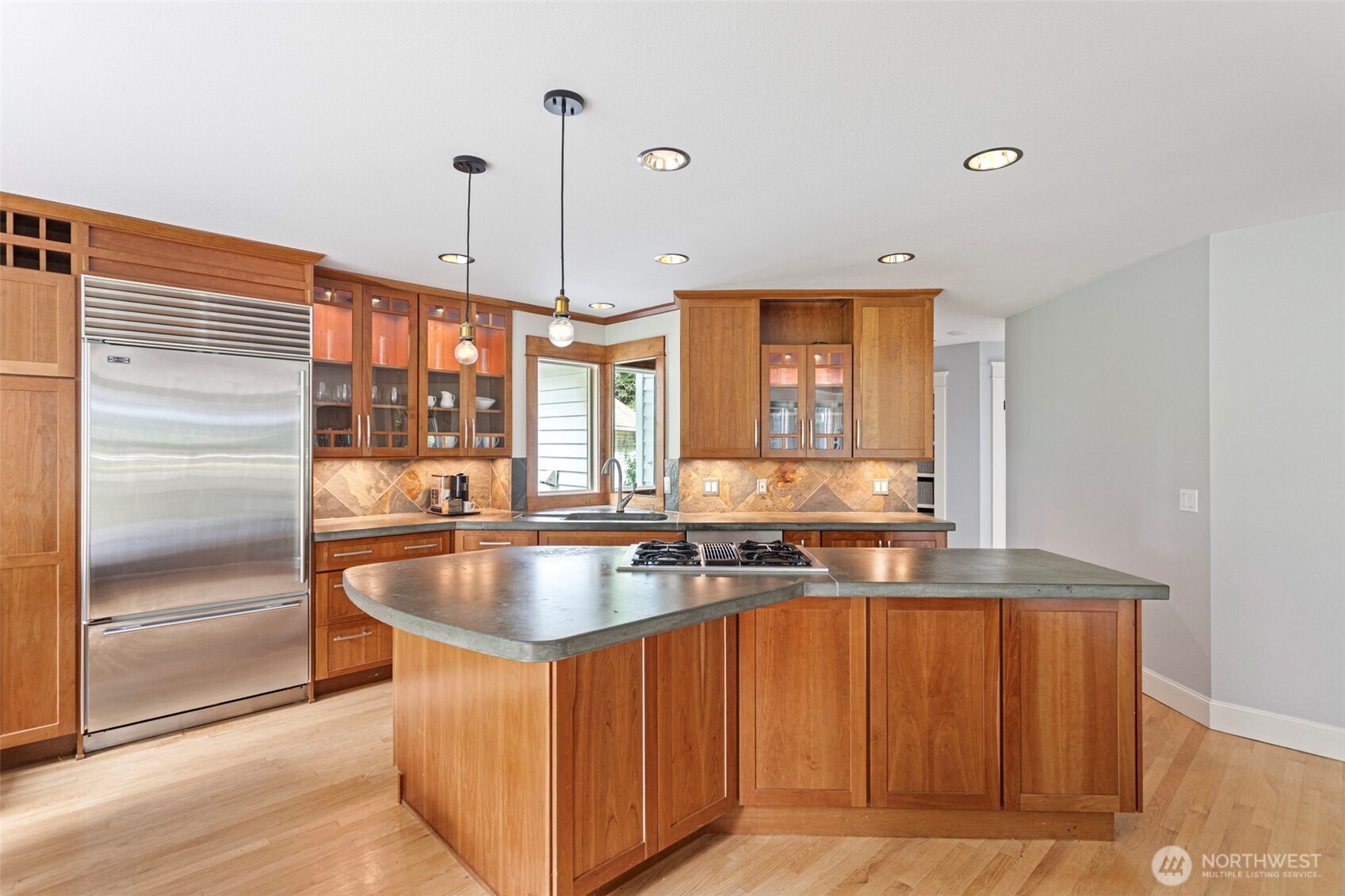 22126 53rd Avenue Southeast Bothell, WA 98021 - Photo 12 of 40 a kitchen with stainless steel appliances granite countertop a sink a counter space and a window