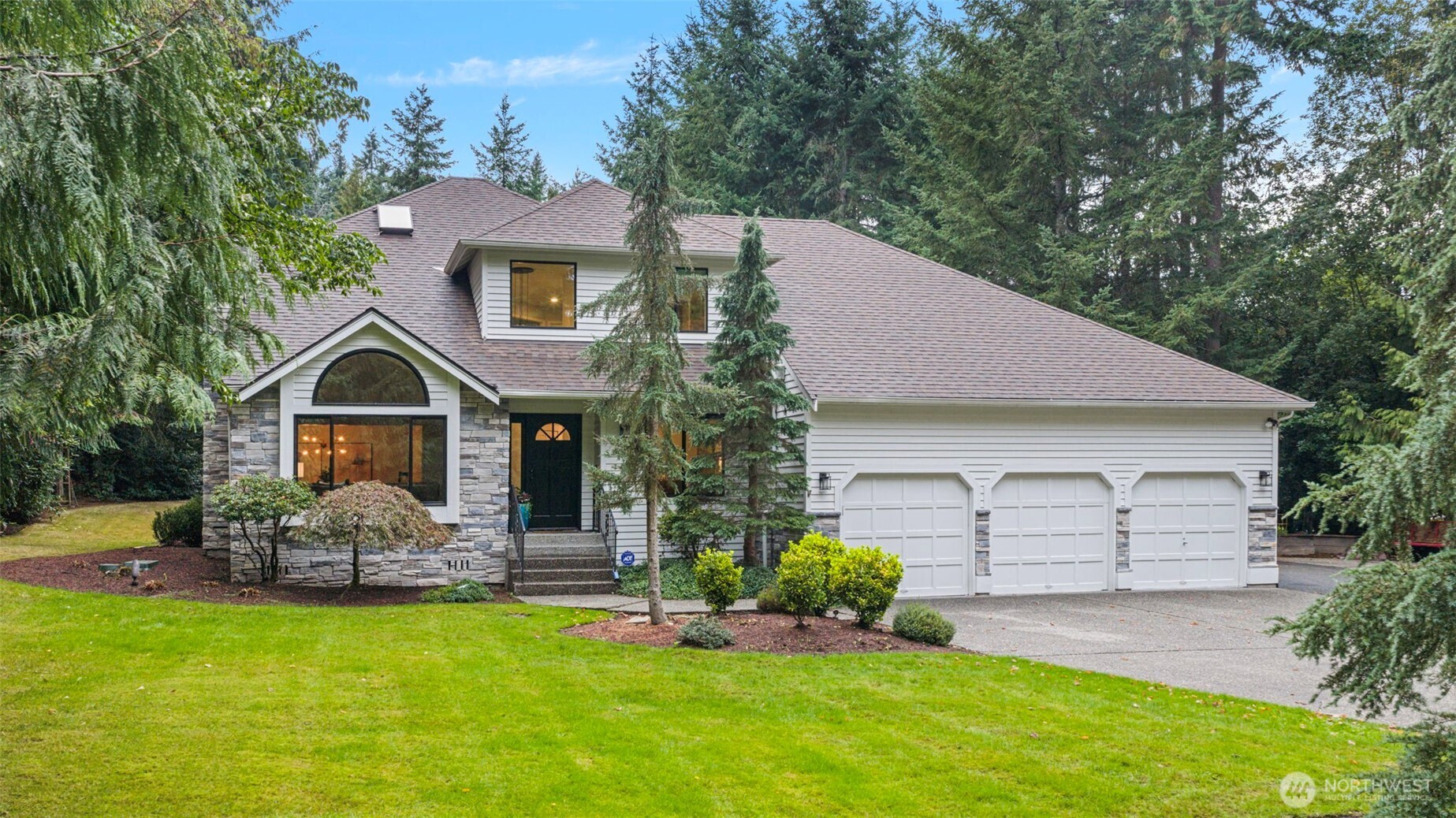 22126 53rd Avenue Southeast Bothell, WA 98021 - Photo 2 of 40 a front view of a house with garden