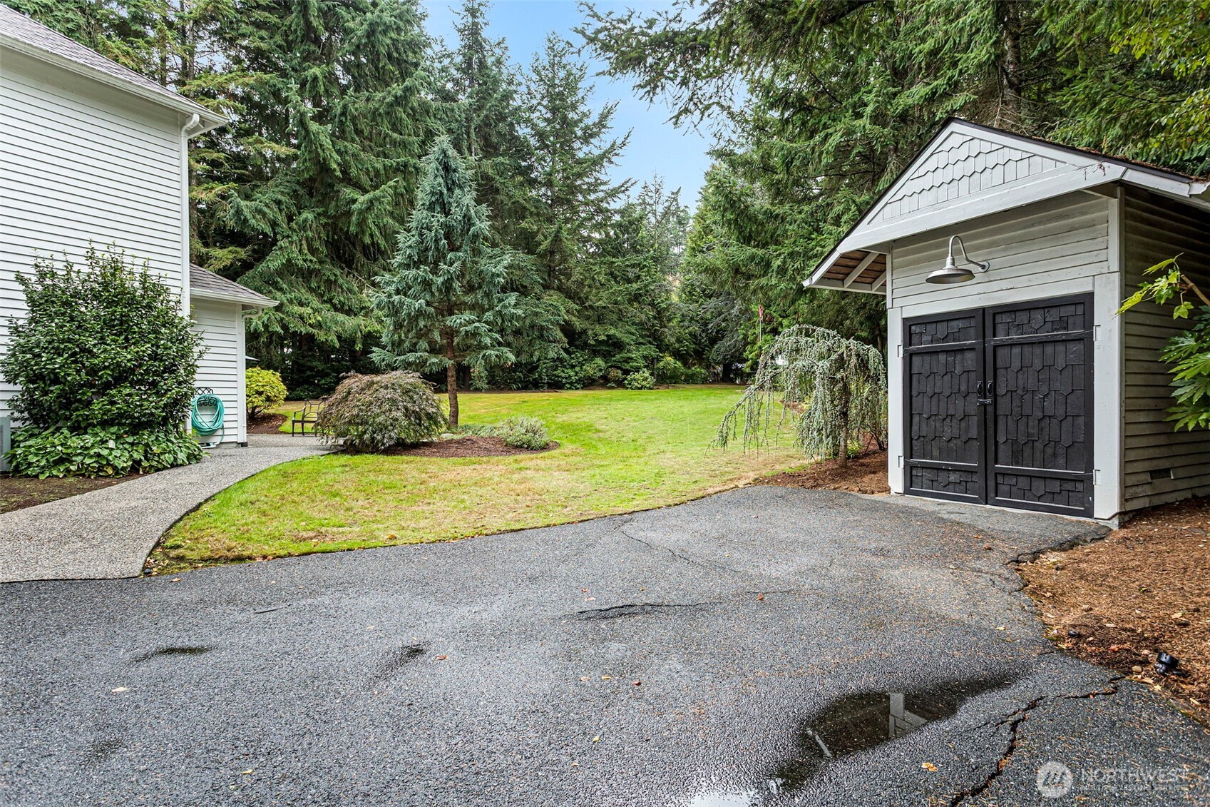 22126 53rd Avenue Southeast Bothell, WA 98021 - Photo 32 of 40 a house with a yard and a large parking space