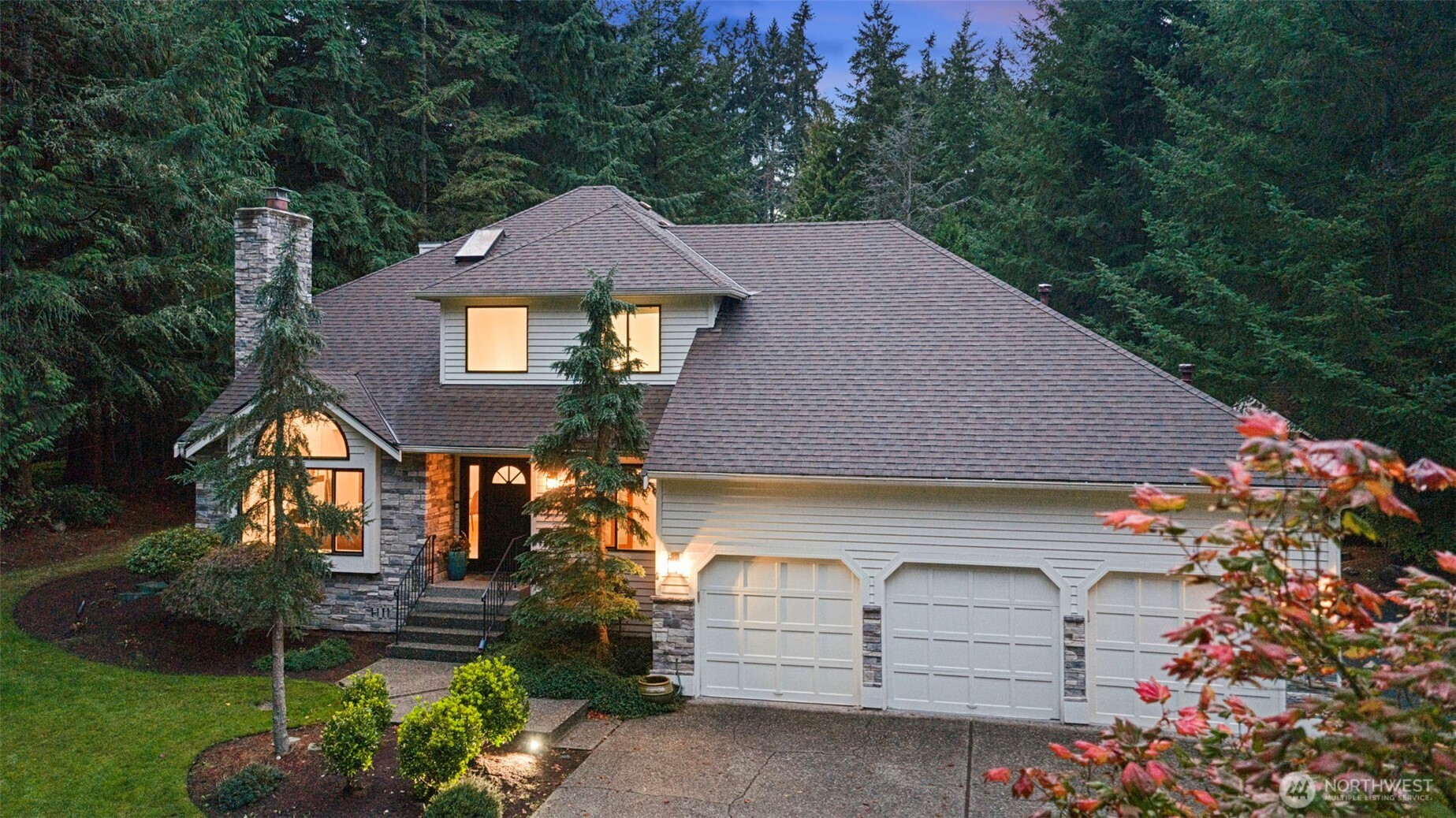 22126 53rd Avenue Southeast Bothell, WA 98021 - Photo 37 of 40 a front view of a house with a garden