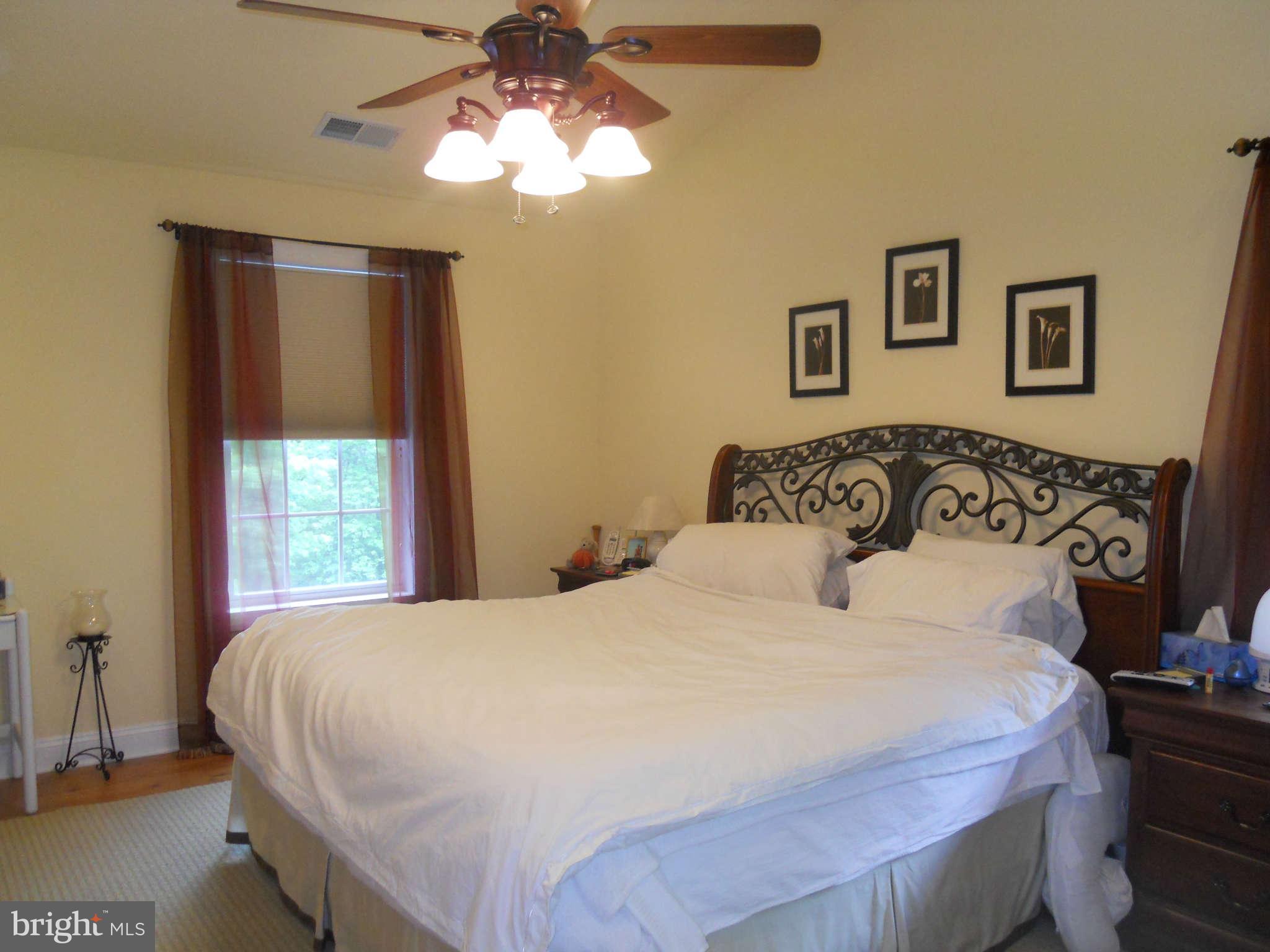 2888 Barrick Road Finksburg, MD 21048 - Photo 13 of 29 a bedroom with a large bed and a window