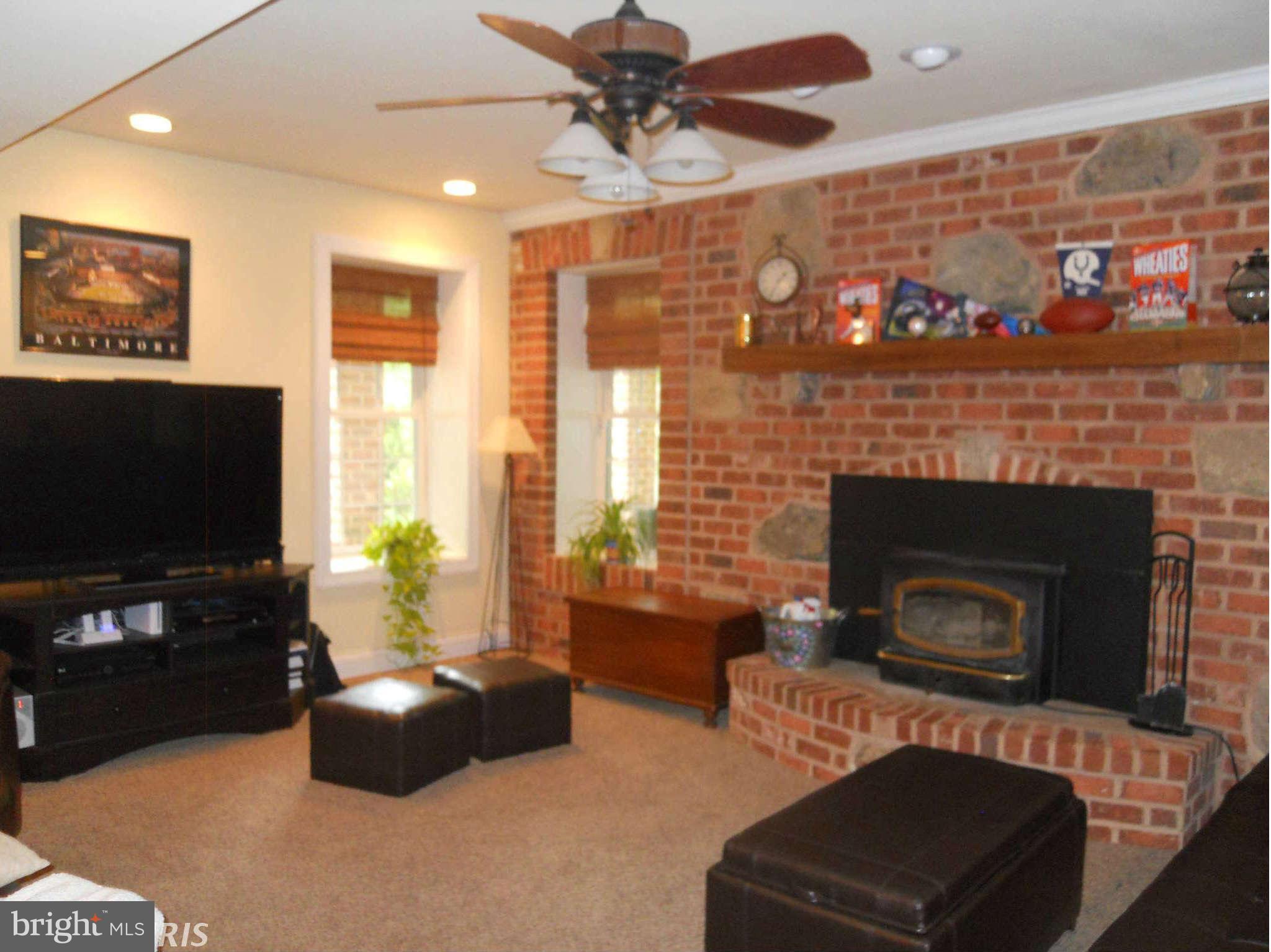 2888 Barrick Road Finksburg, MD 21048 - Photo 18 of 29 a living room with furniture and a fireplace