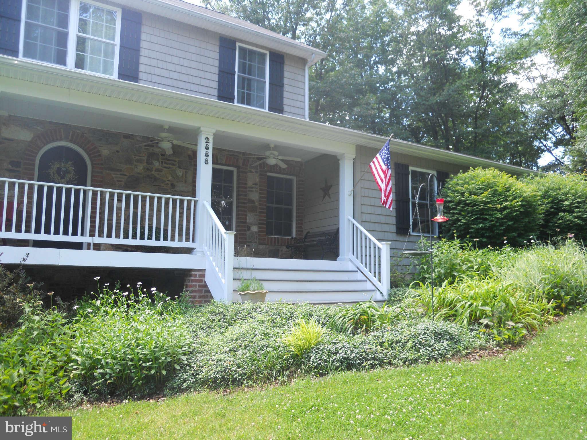 2888 Barrick Road Finksburg, MD 21048 - Photo 25 of 29 a front view of a house with garden