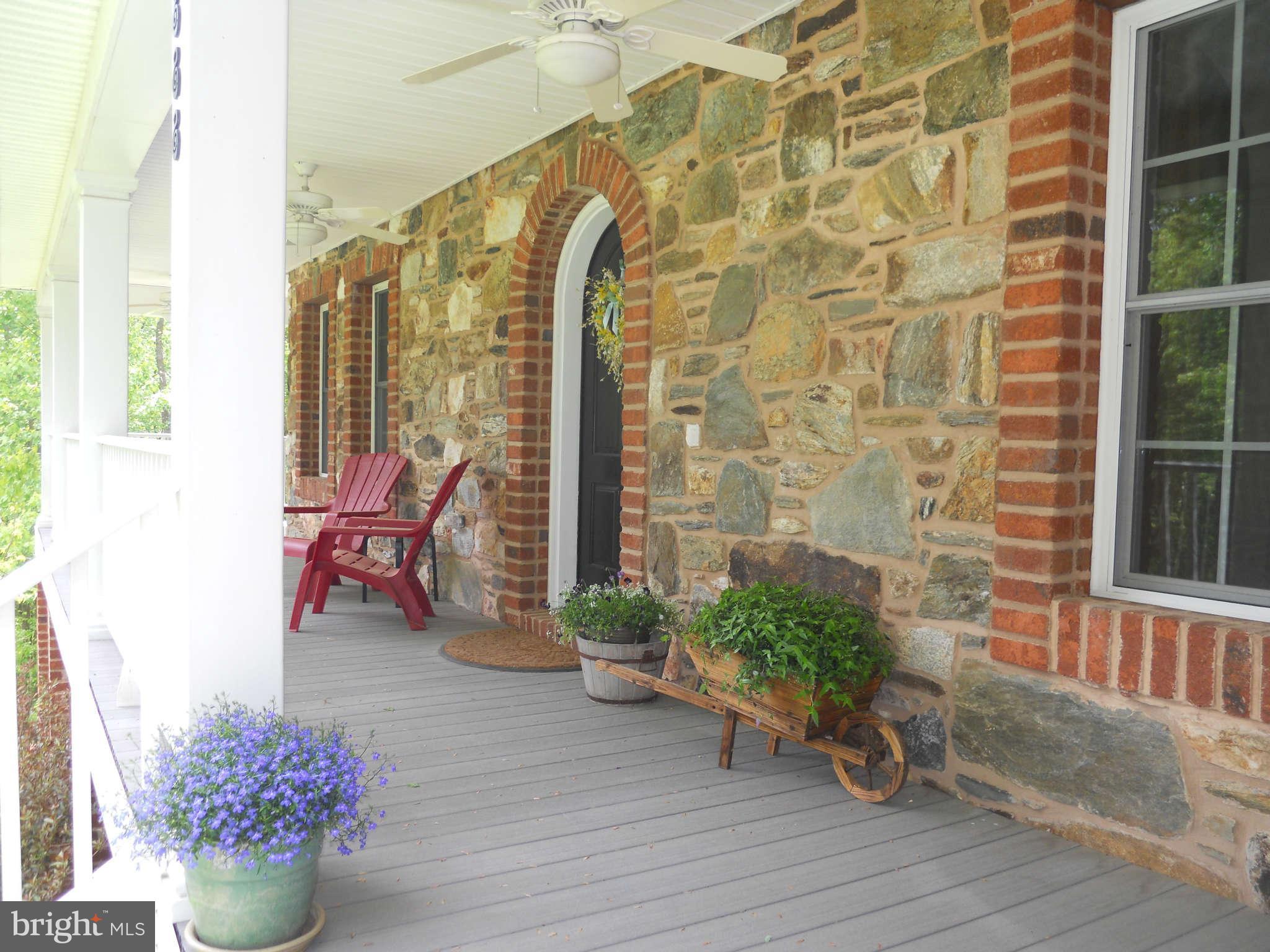 2888 Barrick Road Finksburg, MD 21048 - Photo 5 of 29 a view of a house with a chairs and table in a patio