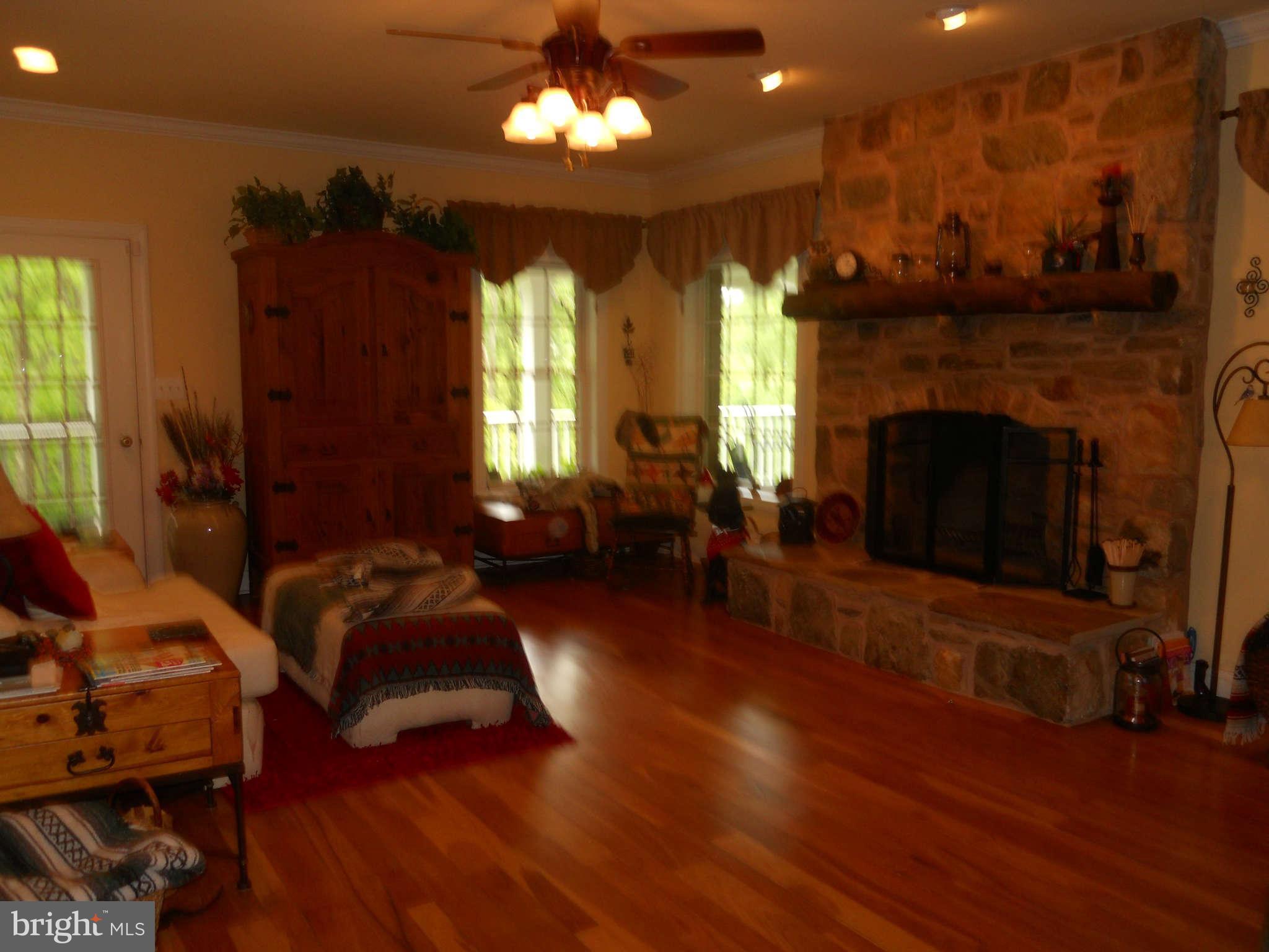 2888 Barrick Road Finksburg, MD 21048 - Photo 9 of 29 a living room with furniture and a fireplace