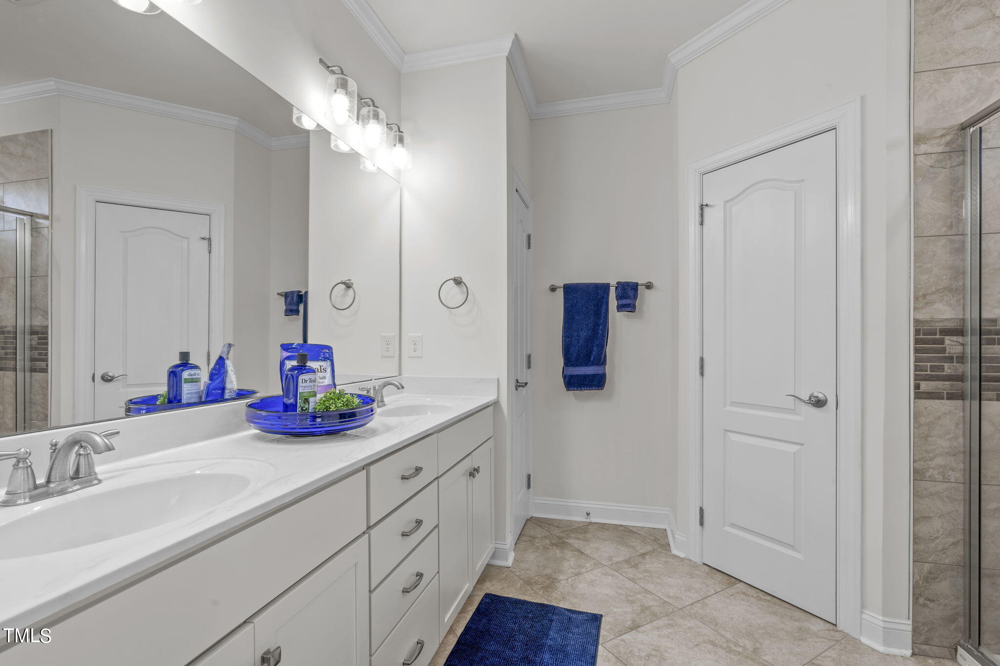 9716 Chris Drive Raleigh, NC 27603 - Photo 33 of 41 Double vanities, large linen closet and private water closet
