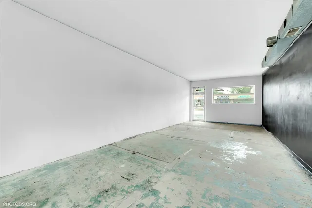 a bedroom with a bed and cabinets