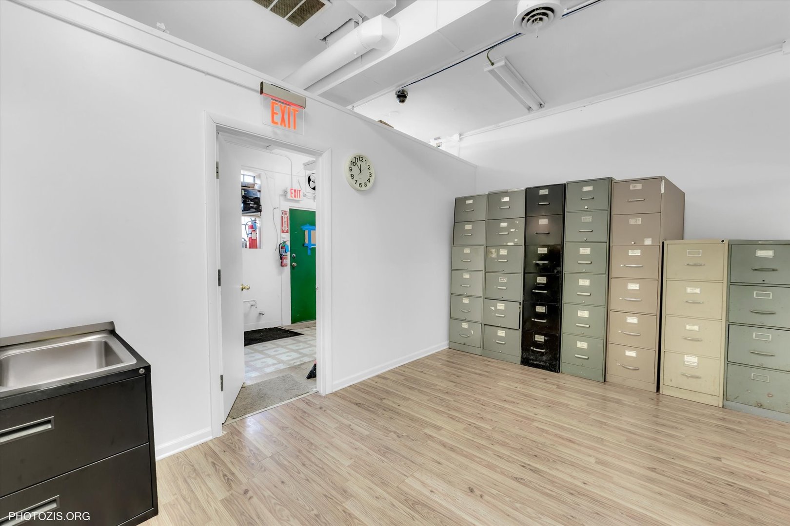 18660 Dixie Highway Homewood, IL 60430 - Photo 24 of 53 a bedroom with a bed and cabinets