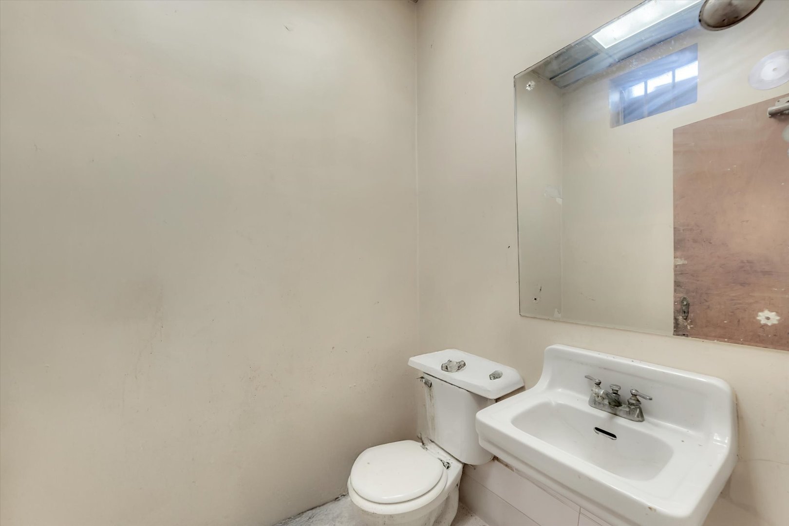 18660 Dixie Highway Homewood, IL 60430 - Photo 33 of 53 a white toilet sitting next to a bathroom sink