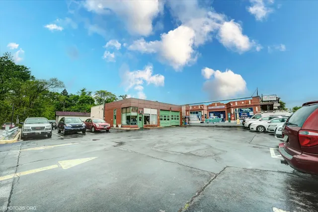 a view of parking garage with cars and other equipment
