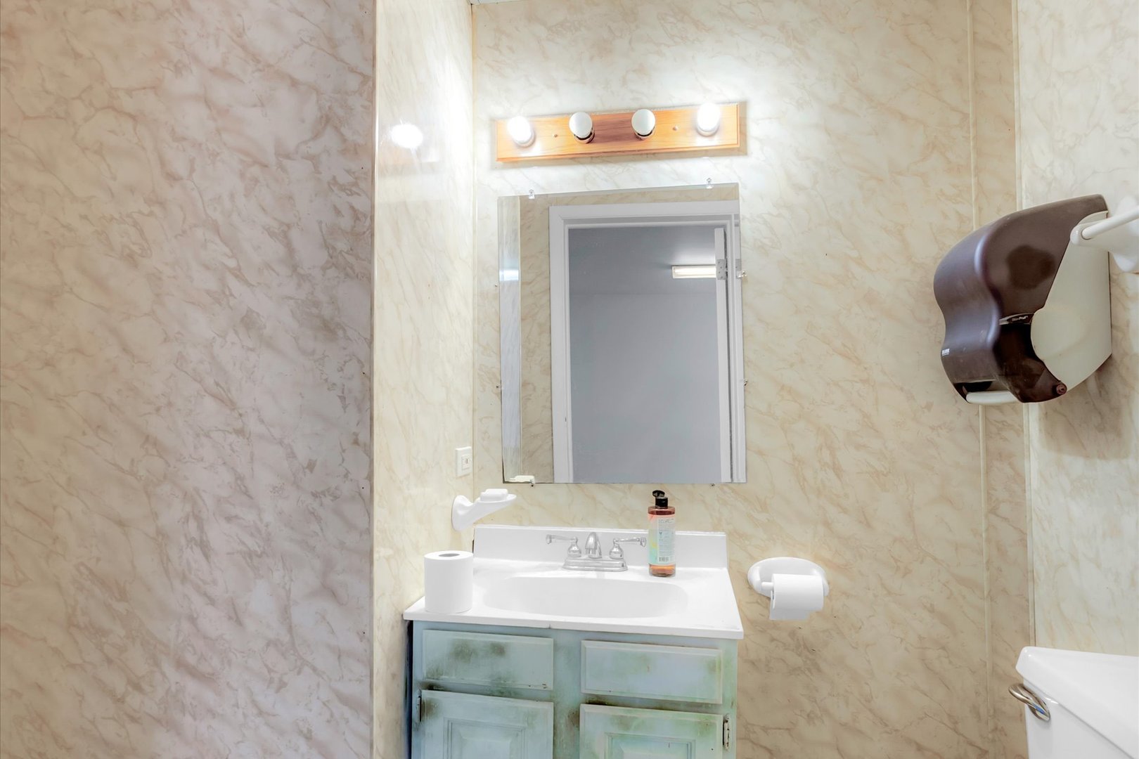 18660 Dixie Highway Homewood, IL 60430 - Photo 46 of 53 a bathroom with a sink and a mirror