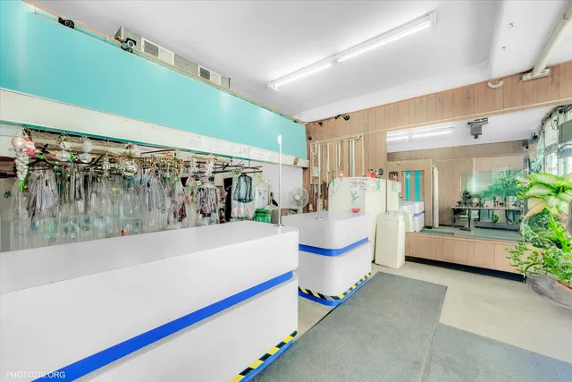 a view of a livingroom with a chandelier fan