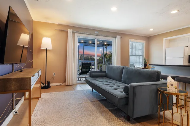 a living room with furniture and a lamp